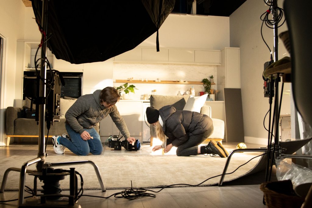 man and woman prepare a photo set