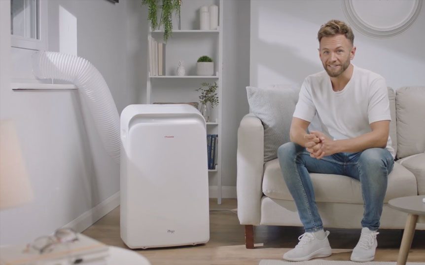man in living room with an air conditioning unit